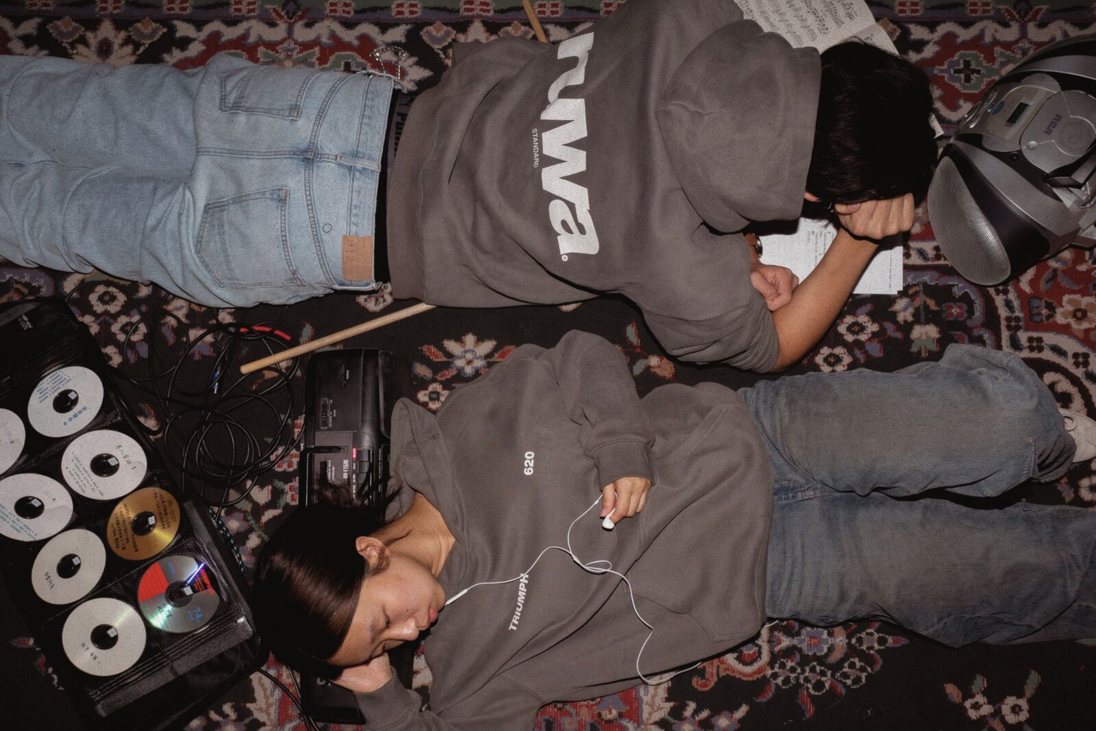 Two students on the floor in Ruwa Standard hoodies