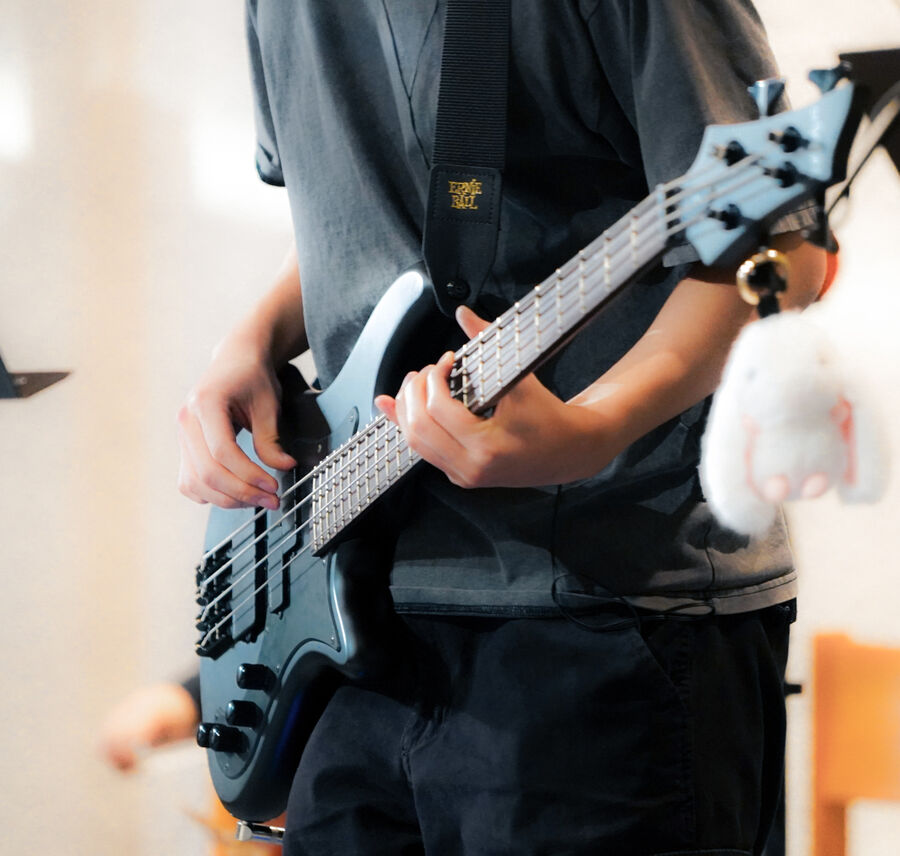 Student playing bass guitar